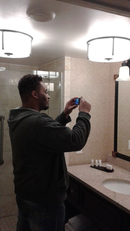 My brother...taking a picture of himself taking a picture in the hotel bathroom