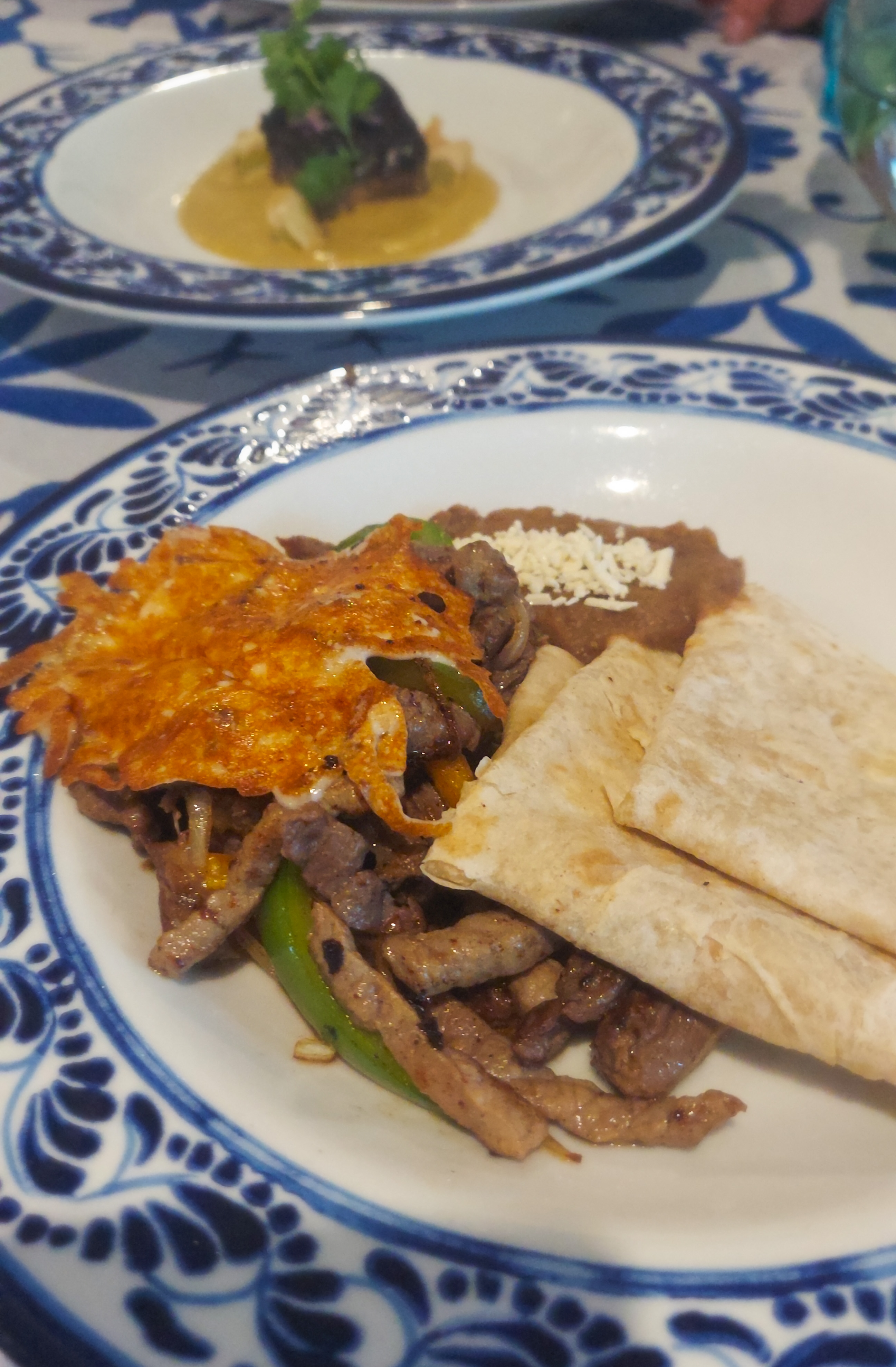 Beef fajitas with cheese cap at El Dorado Seaside Suites